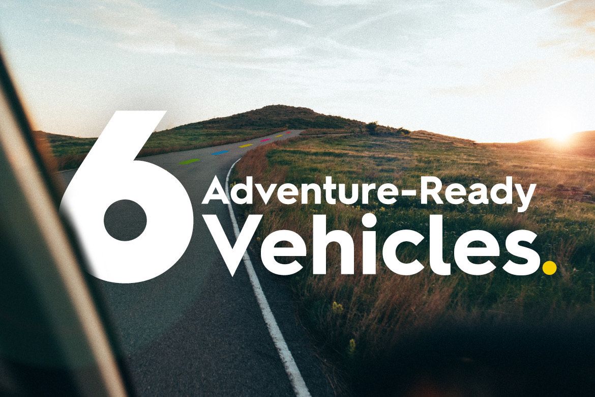A long open road with the text overlay "6 Adventure–Ready Vehicles".