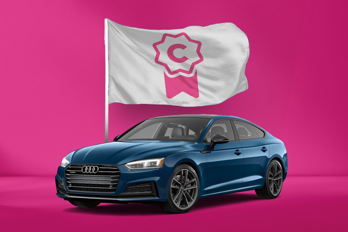 Blue sedan on a pink background with a certified flag overhead. 
