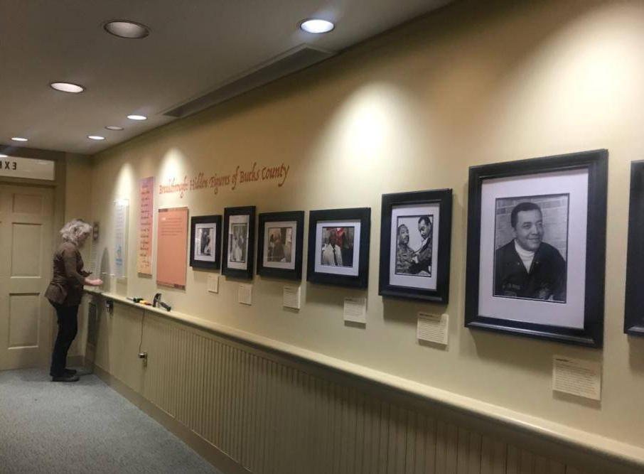 A row of photographs on the wall. 