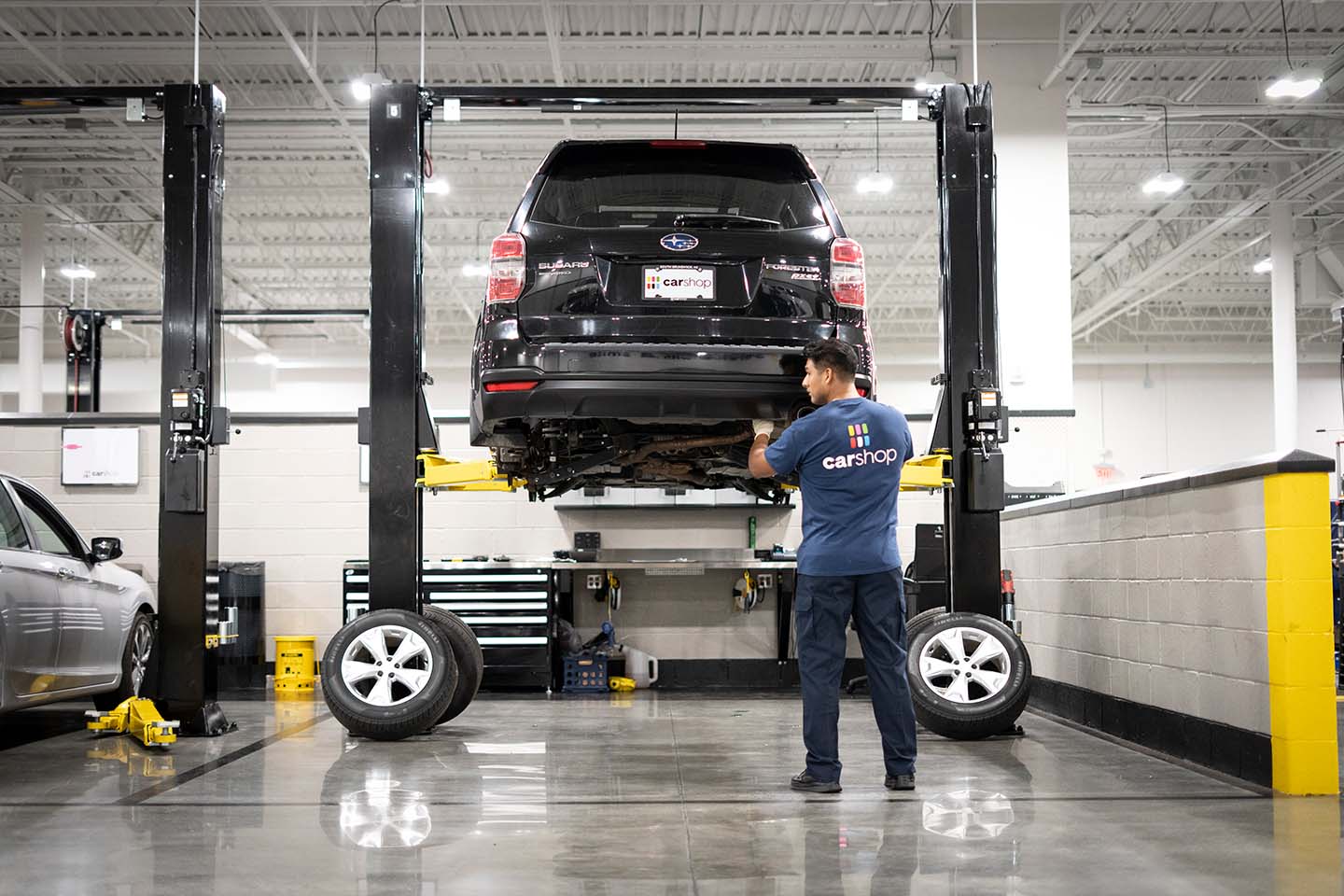 CarShop Service Technicians working on vehicle
